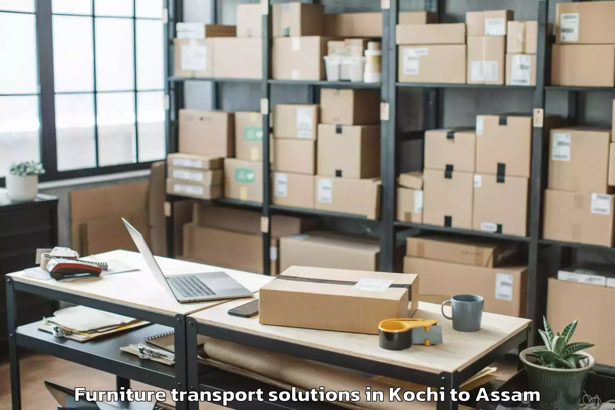 Book Kochi to Bilasipara Pt Furniture Transport Solutions Online